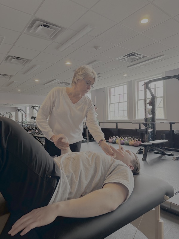 Karen Taylor-Soiles working with a client at AER on Newbury